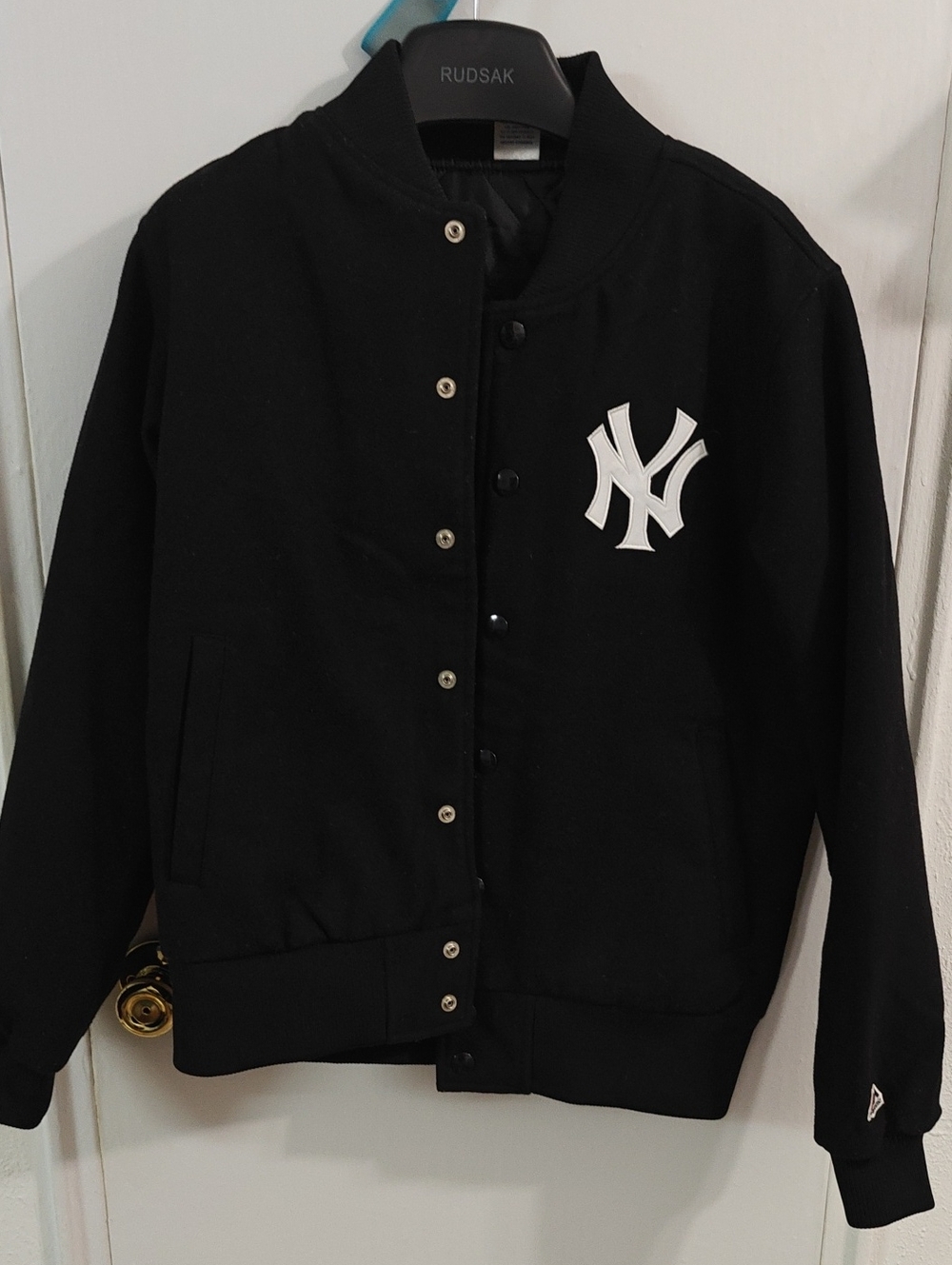 Majestic Black Jacket with Red and Blue Logo Tag